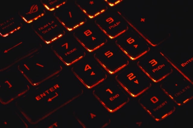 a keyboard with orange lighting underneath
